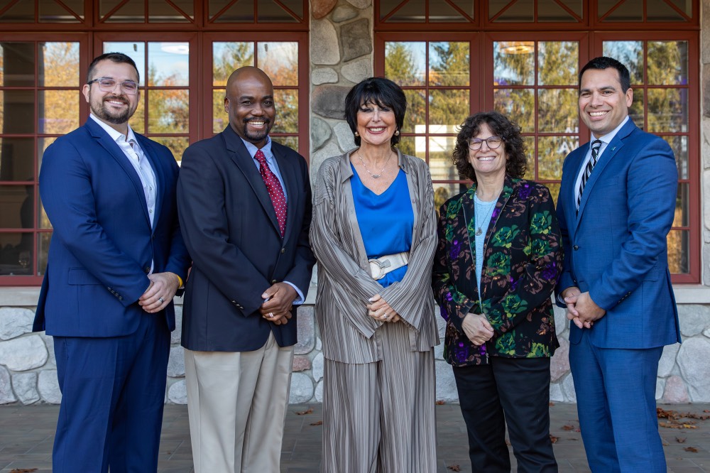 Award recipients pose with GVSU President Mantella